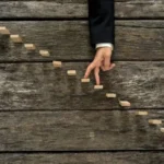 fingers walking up a tiny staircase
