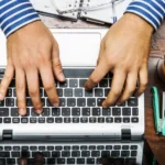 Aerial view of hands on a keyboard