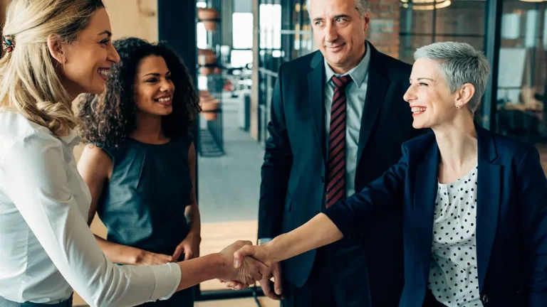 Team of employees in suits meeting