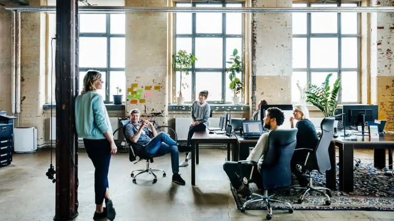 Employees hot desking in the office