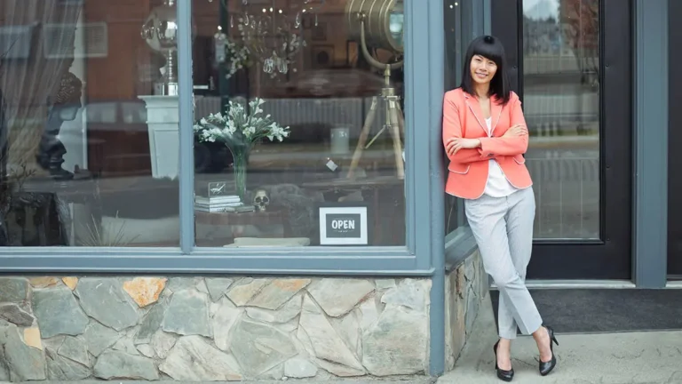 Business owner in front of her shop on Small Business Saturday