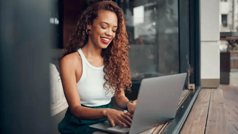 Employee doing content optimization on her laptop.