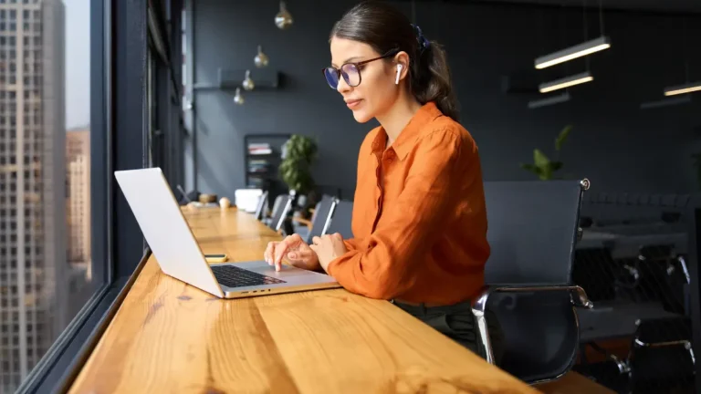 Woman learning about new algorithm changes on laptop.